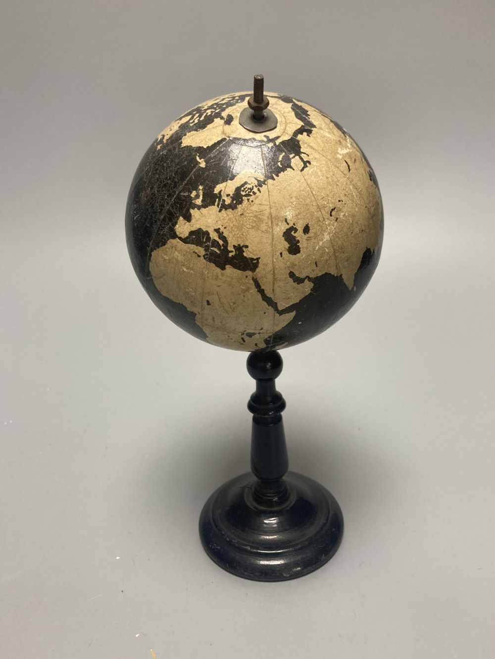 A Reliable Series lithographed tinplate revolving globe, 20cm, and two graphic globes,on ebonised wood bases, one by Philips